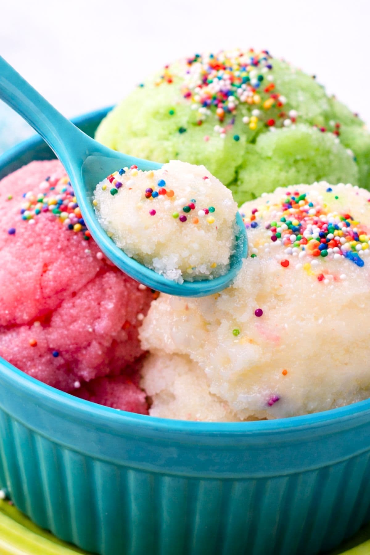 Spoon scooping snow ice cream from a bowl