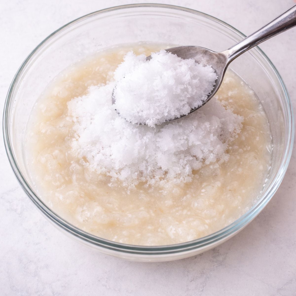 Adding snow to a bowl of snow cream