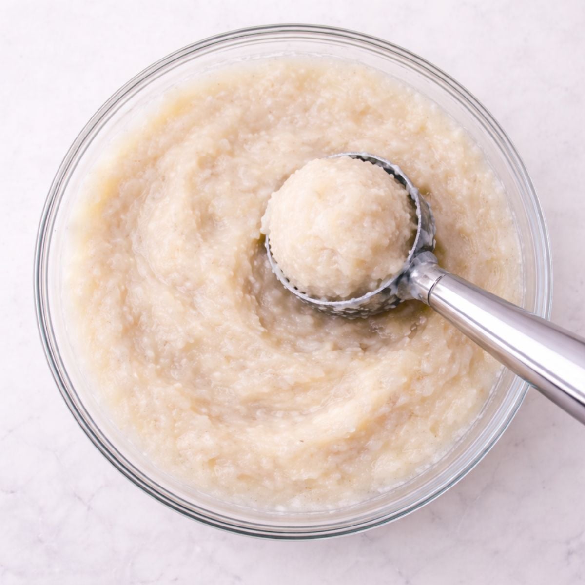 Scooping snow ice cream from a bowl