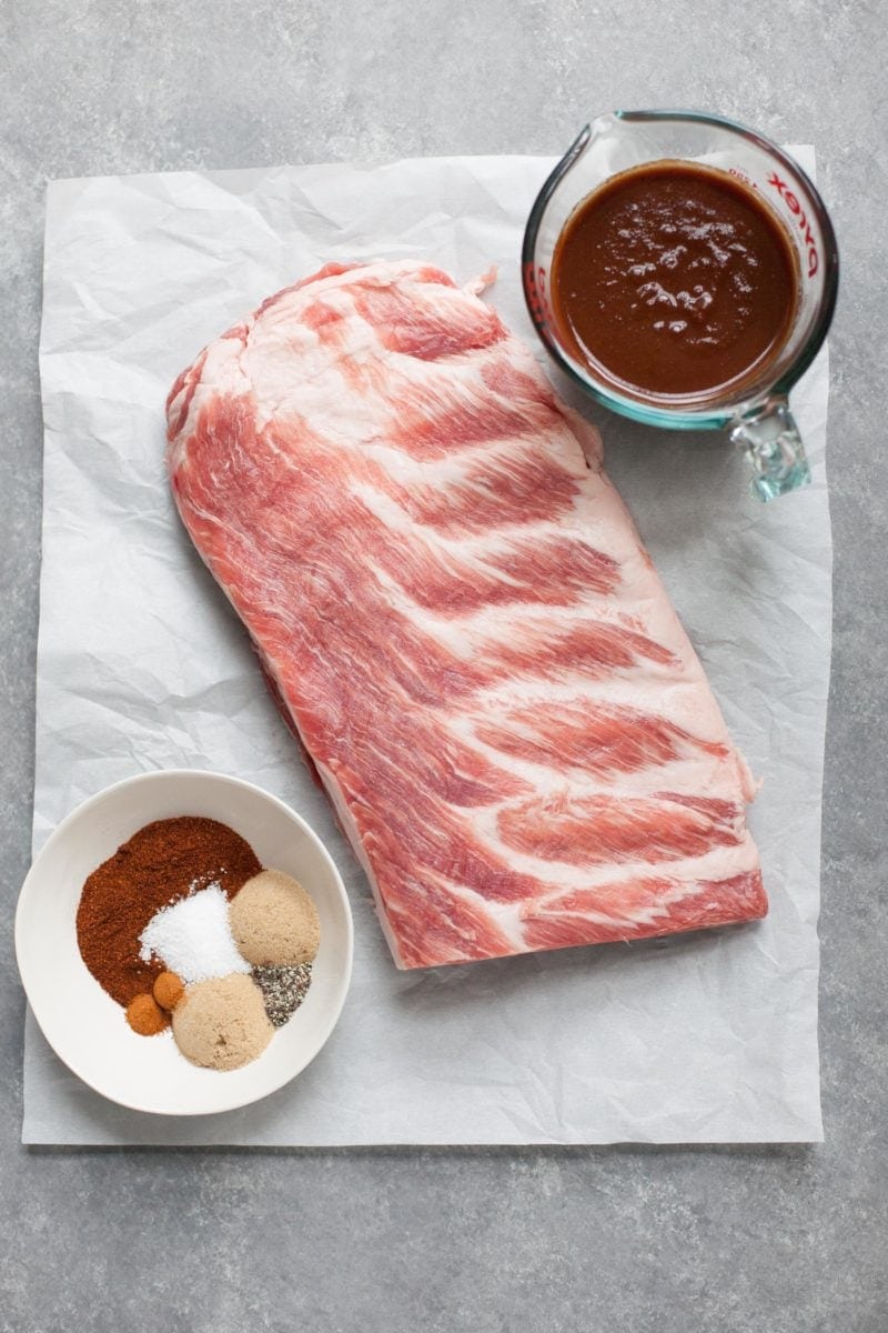 Ingredients for slow cooker Ribs - ribs, barbecue sauce, and spices