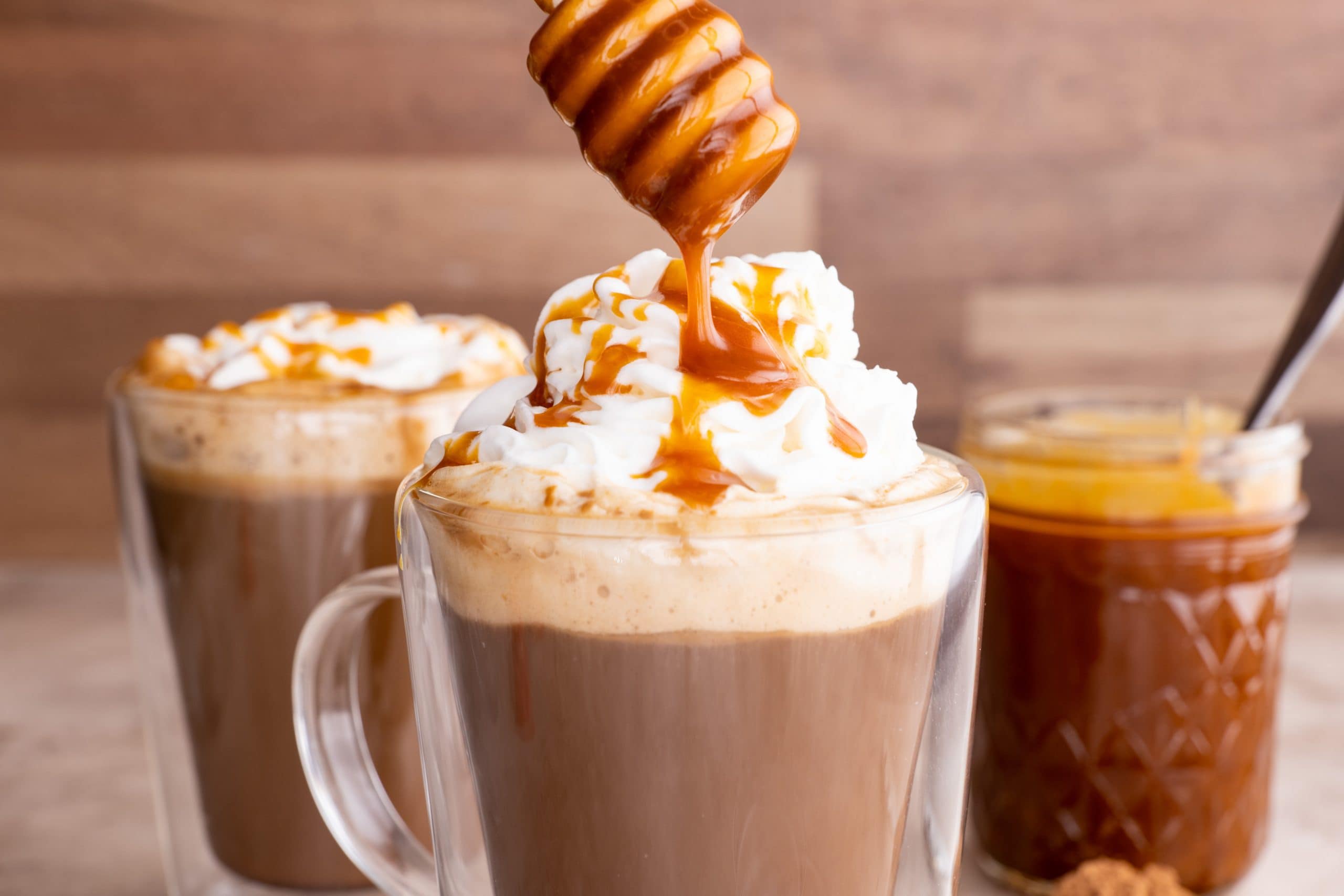 Caramel sauce is drizzled over a salted caramel mocha