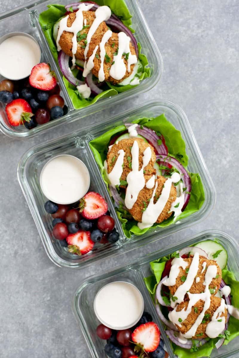Meal Prep Baked Falafel Lettuce Wraps packed into glass lunch containers with mixed berries