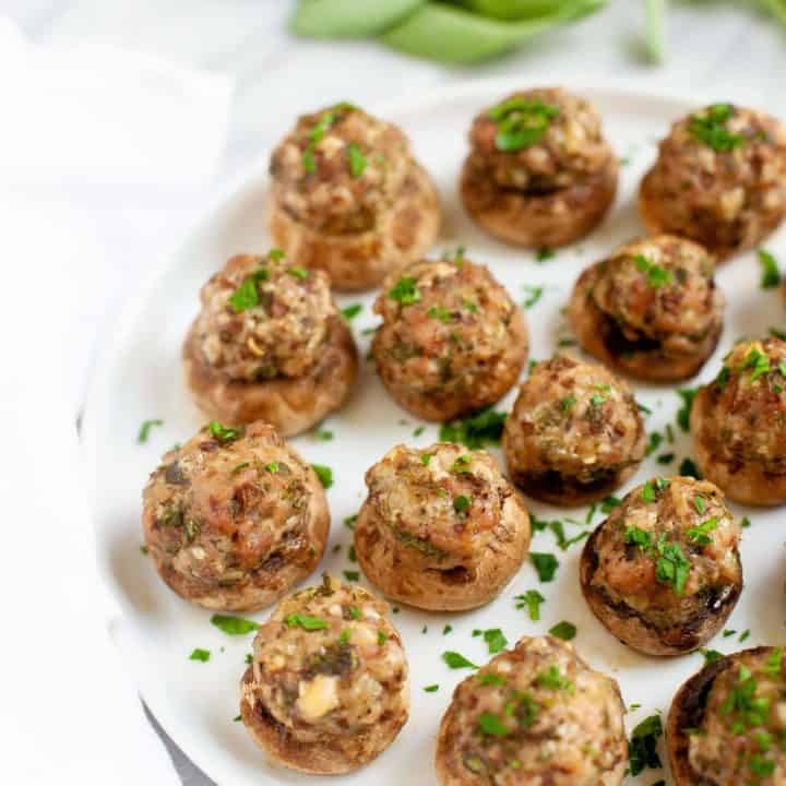 Parmesan and Sausage Stuffed Mushrooms on a white plate