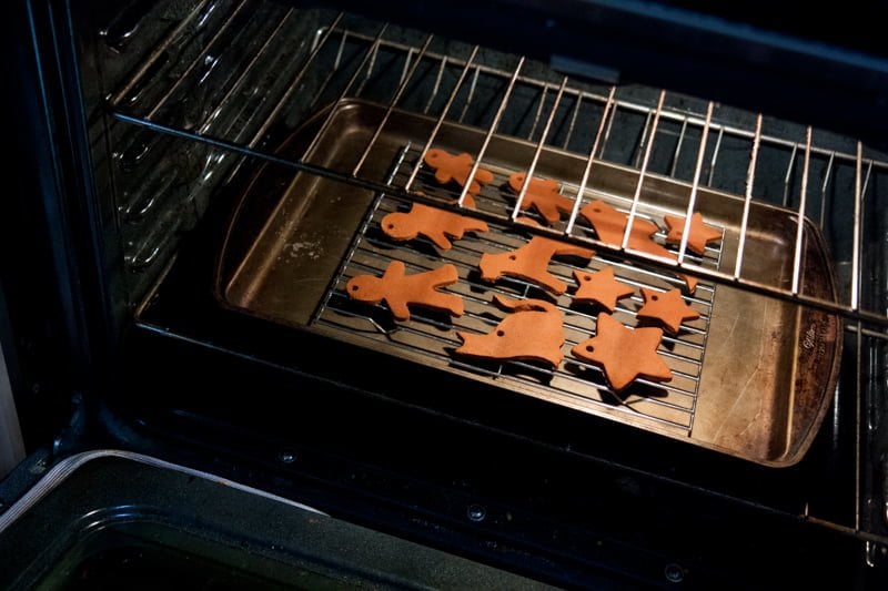 Tray of gingerbread ornaments in the oven