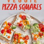 Off-white plate of Cold Veggie Pizza Appetizers cut into squares. A text overlay reads "Healthy Appetizer! Veggie Pizza Squares"