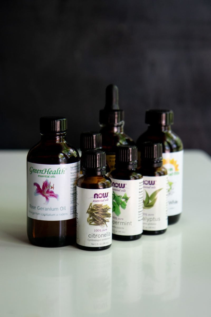 Side shot of a cluster of bottles of essential oils