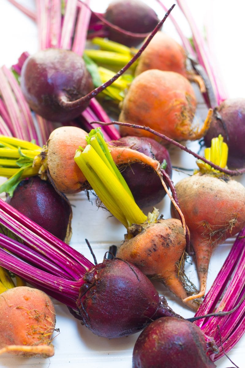 Red and Golden Beets arranged on a white background