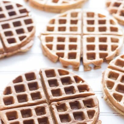 Whole Wheat Frozen Waffles sit on a white background.