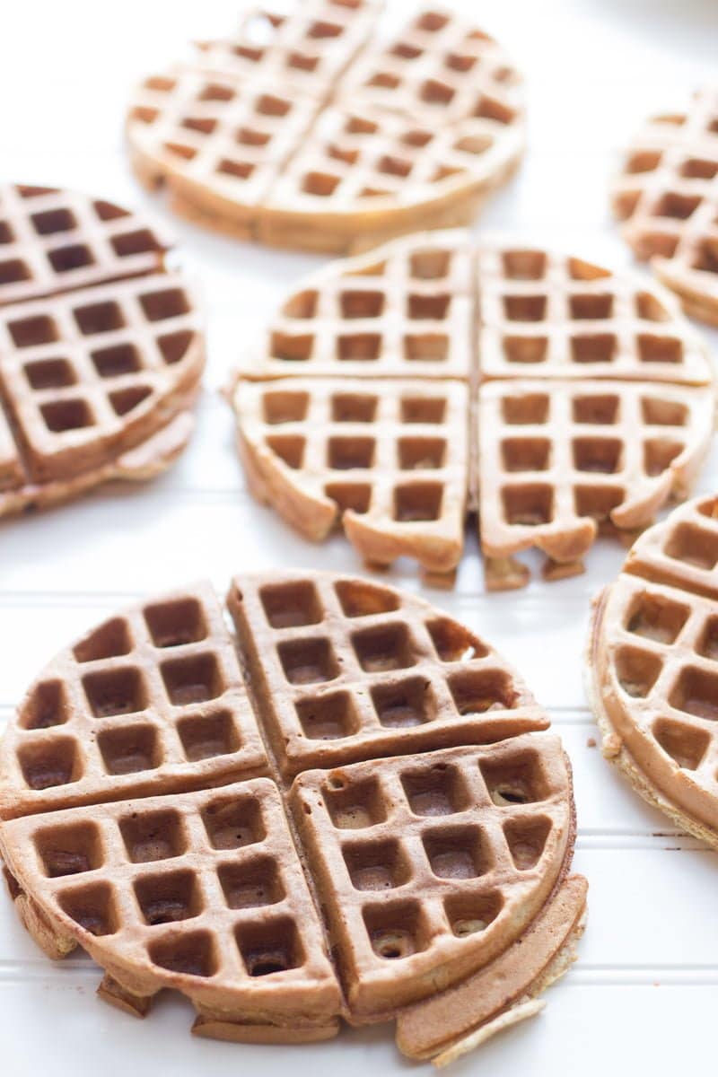 Whole Wheat Frozen Waffles sit on a white background.