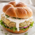 Zucchini chicken burger on a bun on a plate