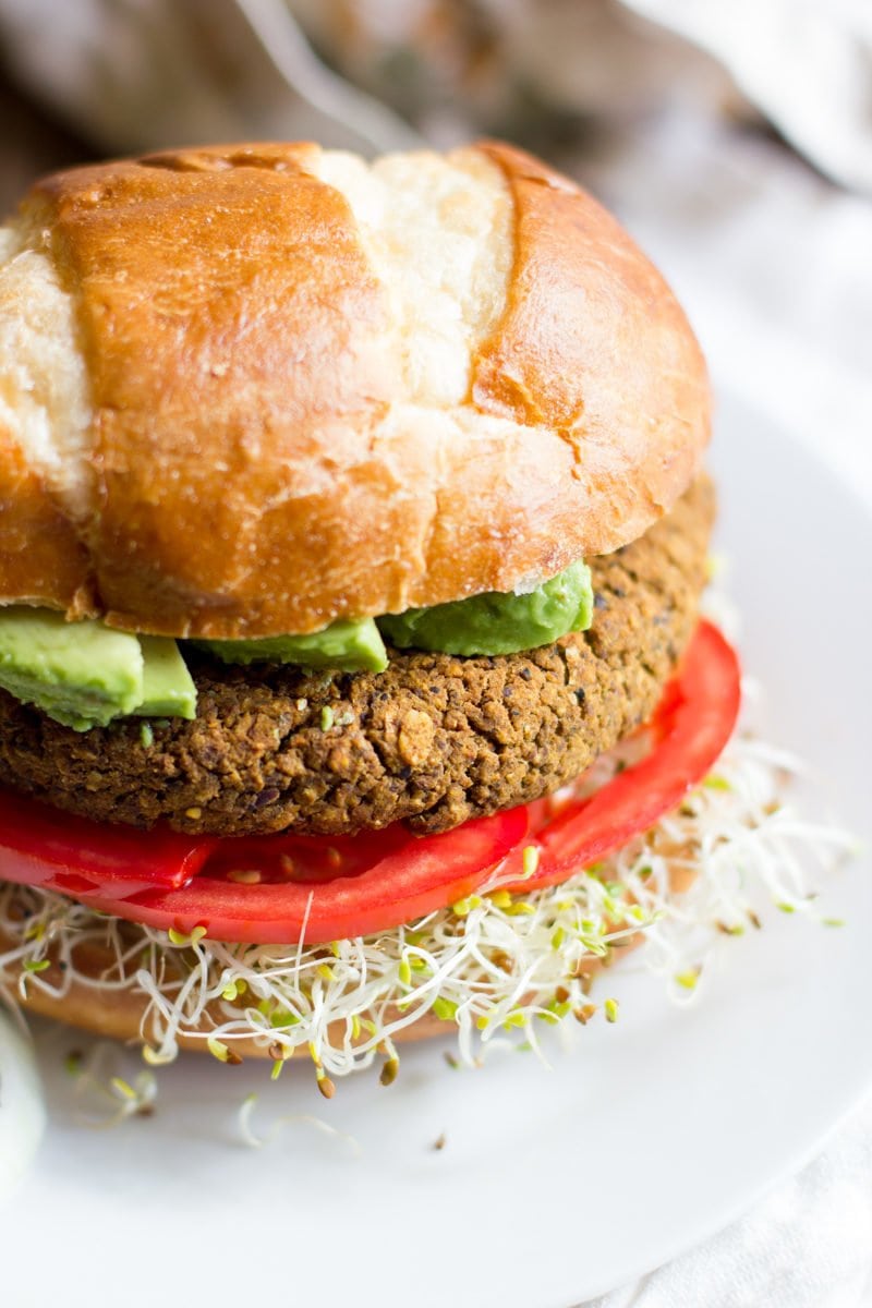 A Pumpkin Black Bean Burger sits on a white plate.