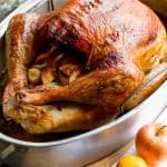 Whole Roasted Turkey in a metal roasting pan