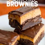 A pile of layered brownies sits on a white plate. A text overlay reads "3 Layer Pumpkin Brownies."
