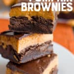 A stack of layered brownies sits on a white plate. A text overlay reads "3 Layer Pumpkin Brownies."