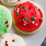 Lofthouse Sugar Cookies decorated in white, green, and red frosting, topped with sprinkles