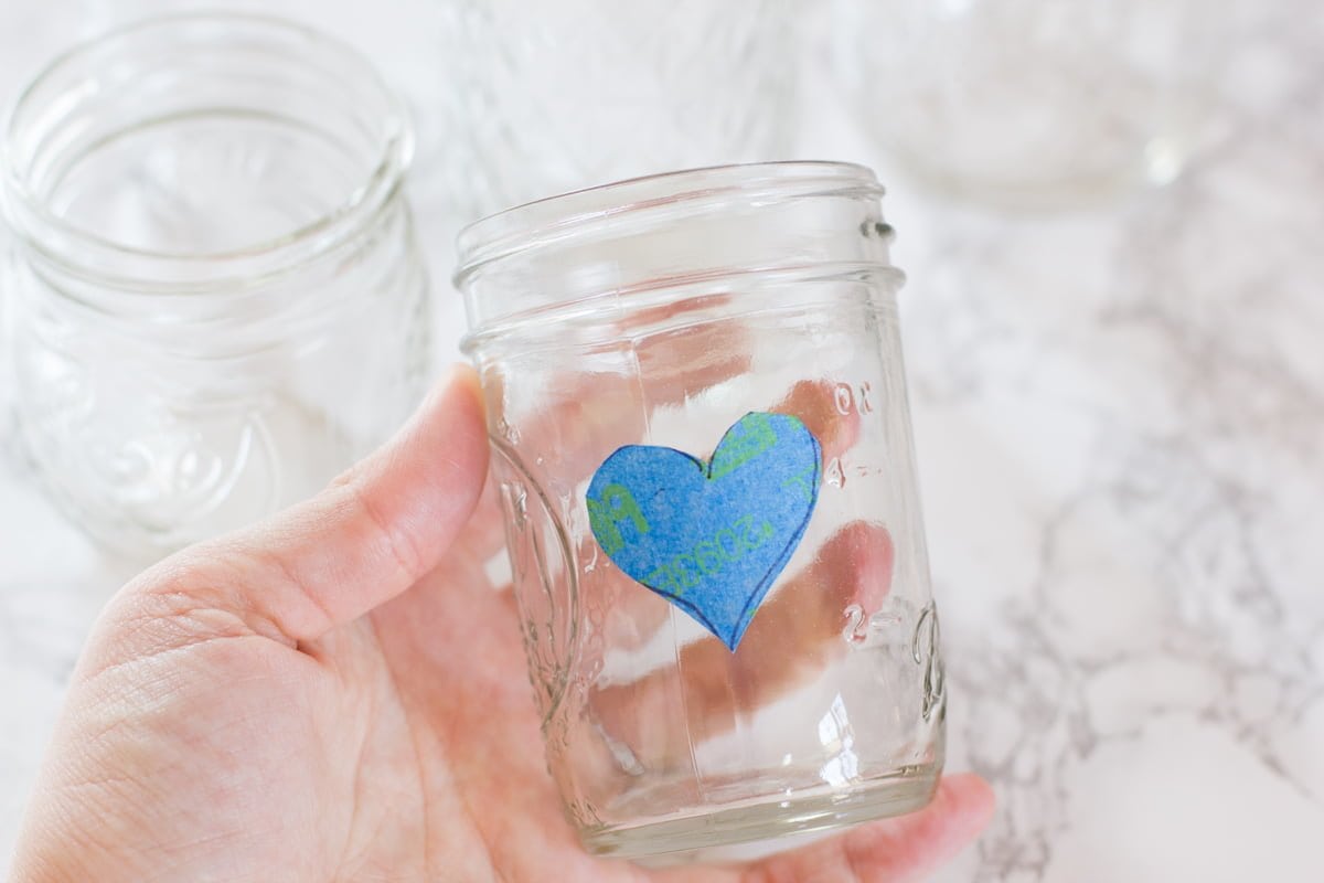 Heart made of painter's tape on an empty mason jar