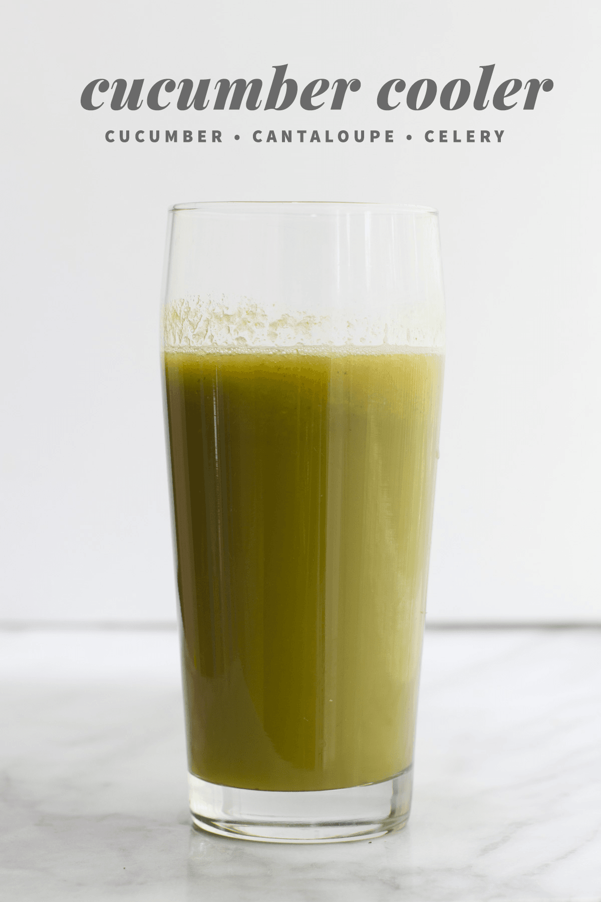 A cucumber cooler juice recipe in a glass, made with cucumber, cantaloupe, and celery.