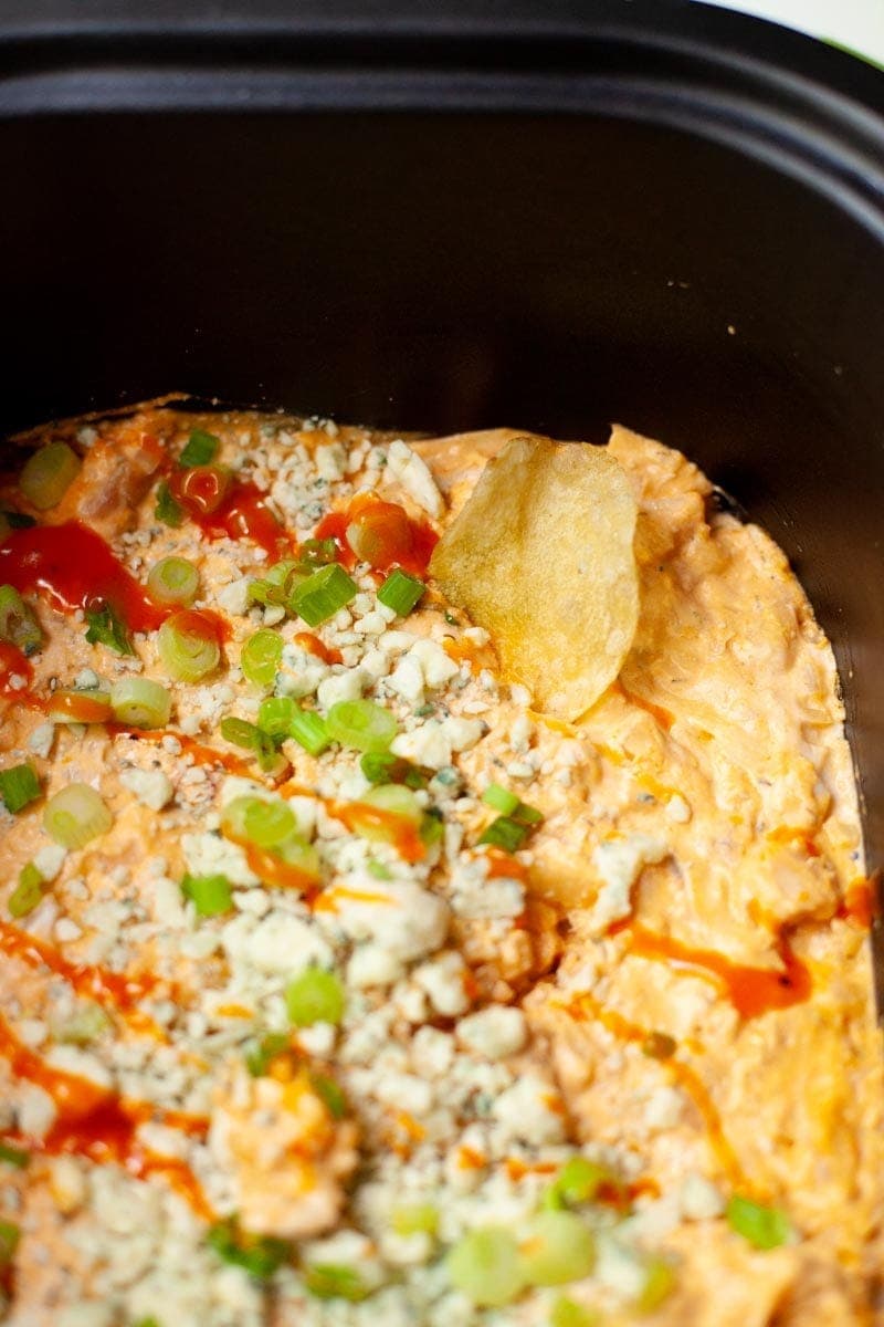 Close up on buffalo chicken dip in a slow cooker