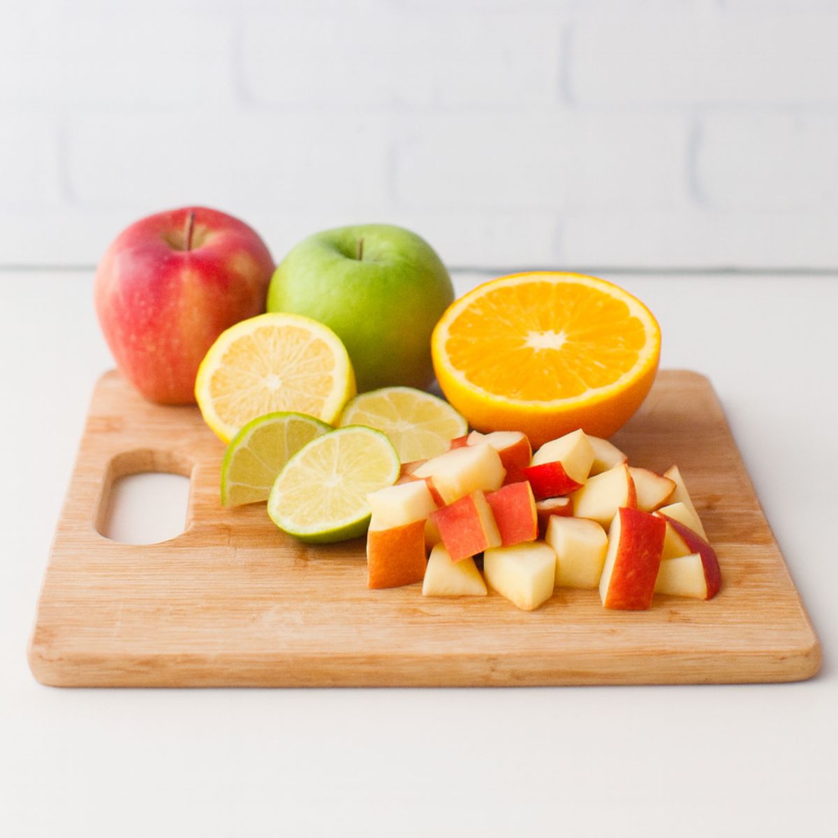 Cutting sangria fruit on a cutting board