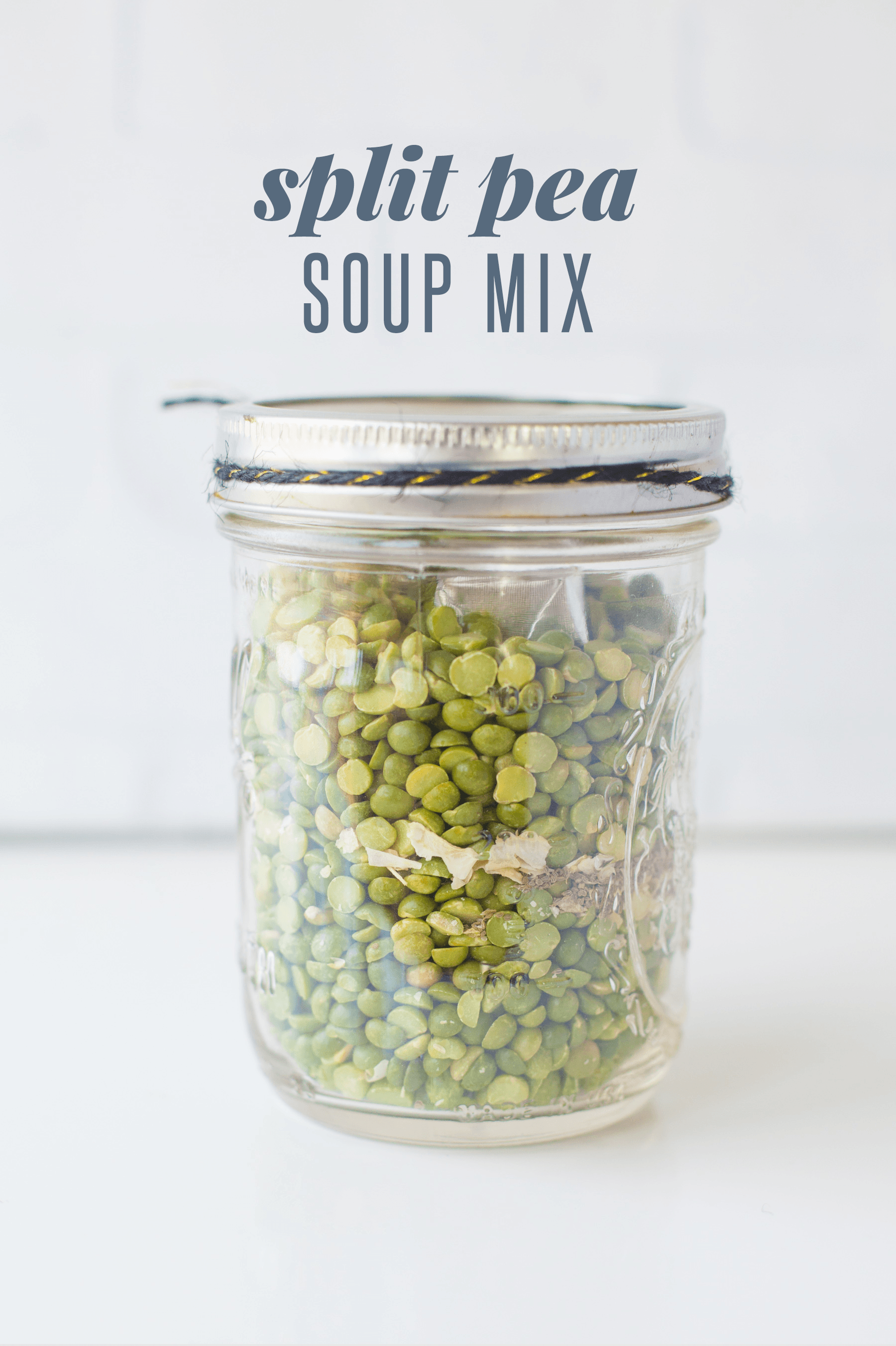 Mason jar full of split peas and spices. A text overlay reads "Split Pea Soup Mix"