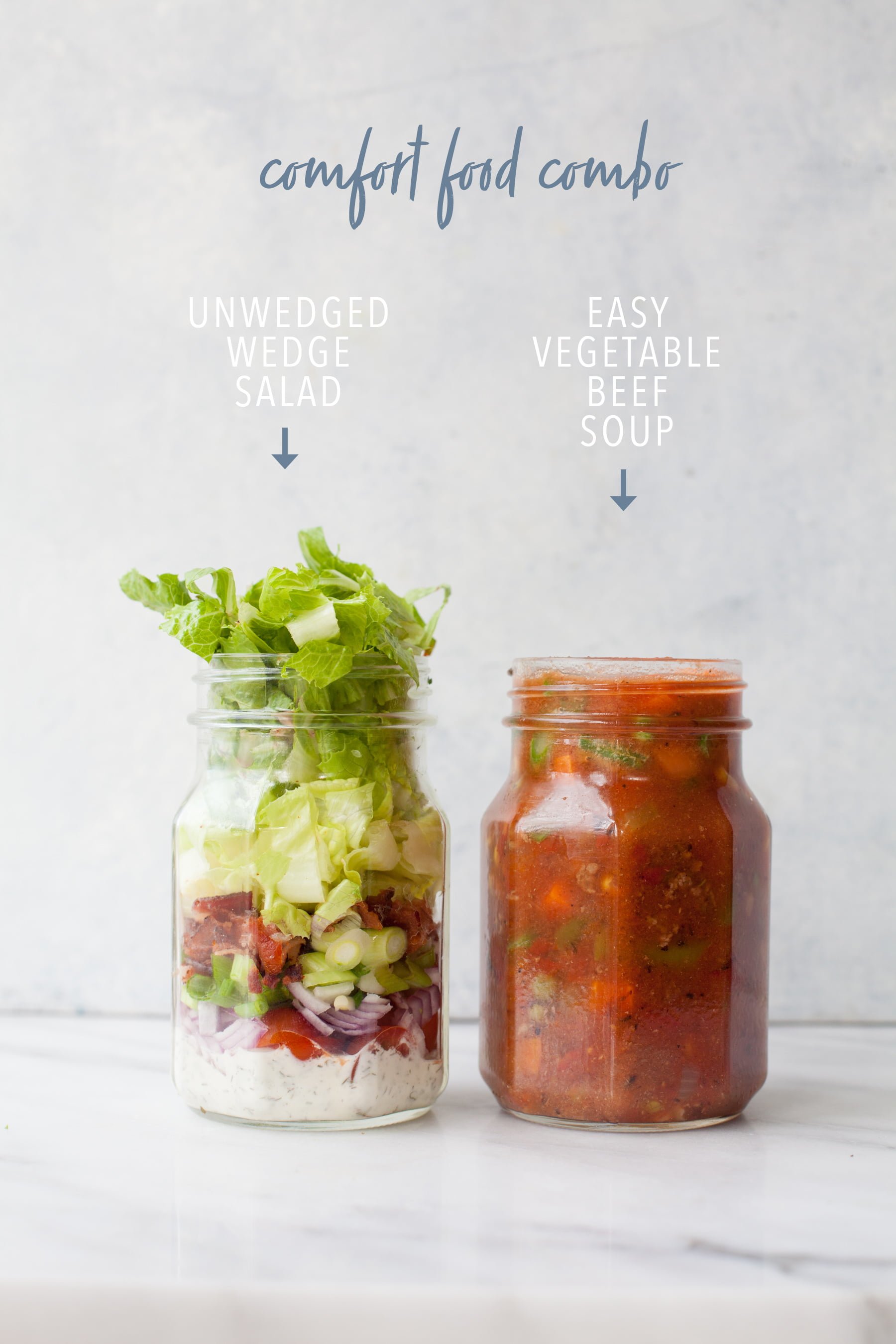 Two canning jars on gray background, one with salad and one with soup