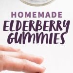 A hand holds a Lego-shaped gummy under a jar of gummies. A text overlay reads "Homemade Elderberry Gummies."