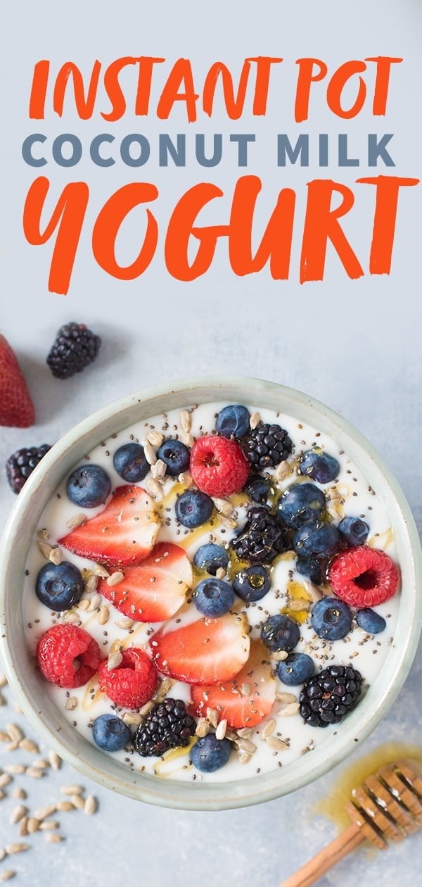 Overhead shot of a bowl of Instant Pot coconut yogurt garnished with mixed berries, seeds, and honey; with a text overlay
