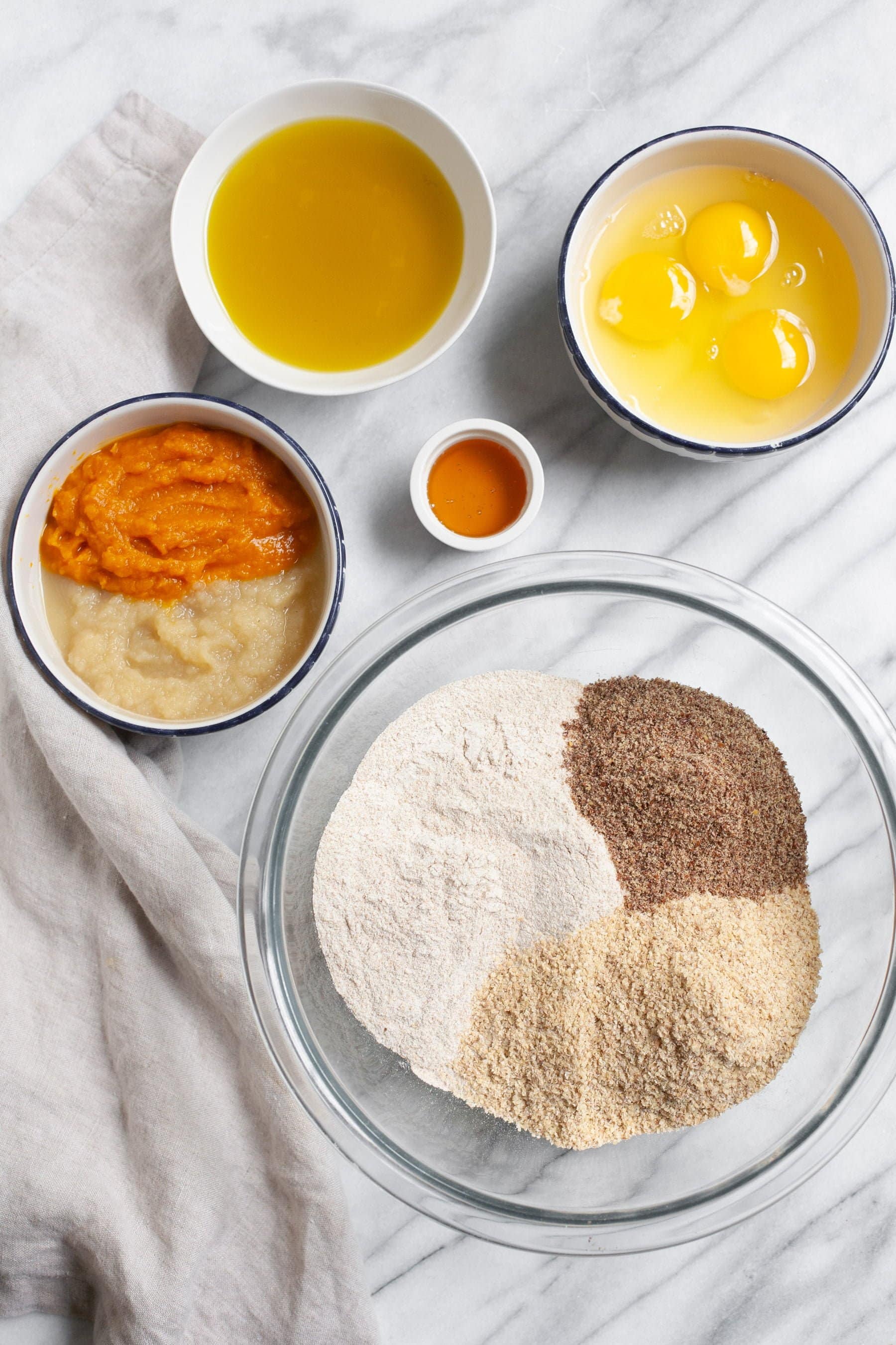 Ingredients for Healthy Homemade Dog Treats on a marbled white background