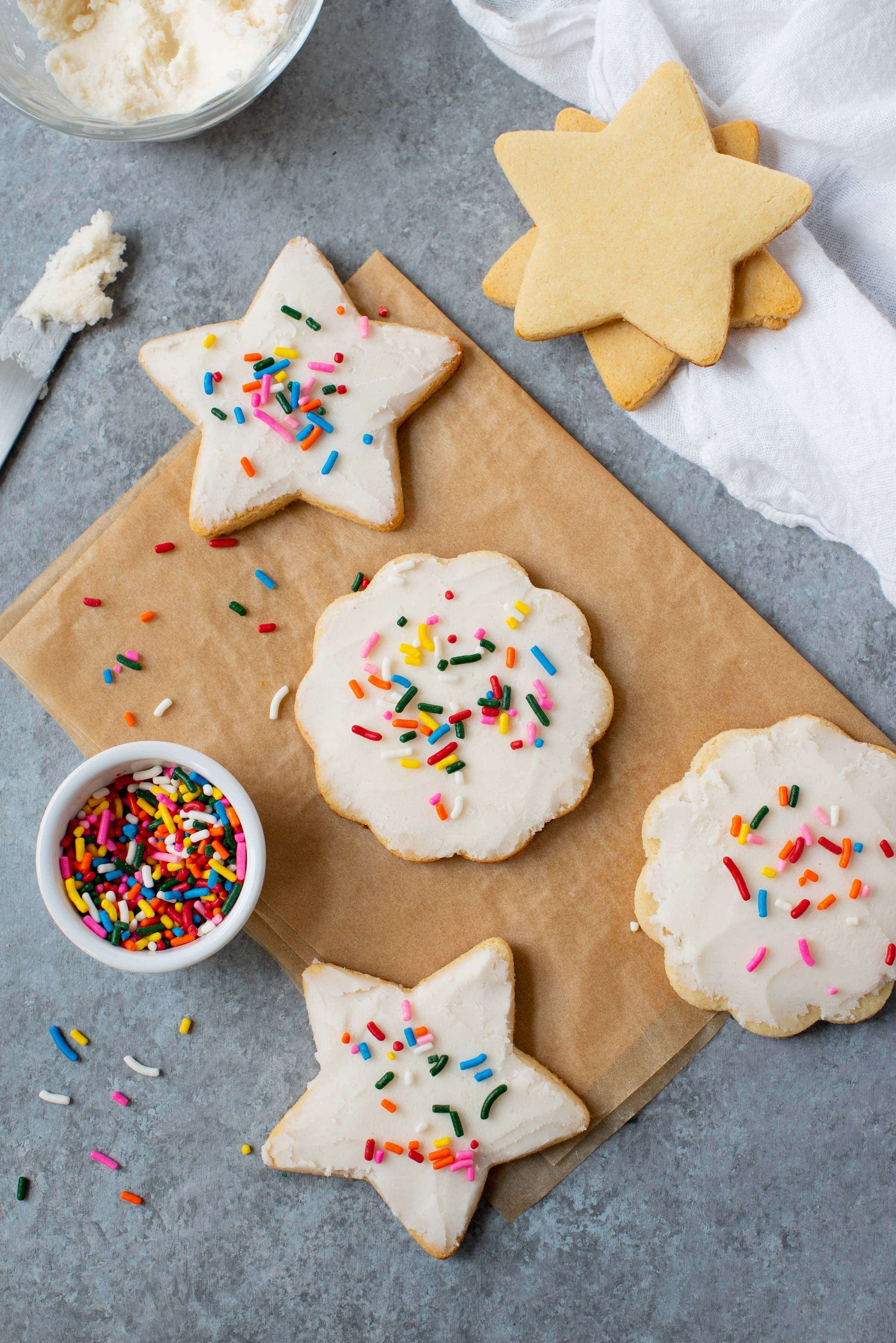 Grain-free paleo sugar cookies with coconut butter frosting and rainbow sprinkles