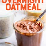 A glass jar filled with a chocolate flavored overnight oatmeal with a spoon dipped into it. A text overlay reads "How to Make Overnight Oatmeal."