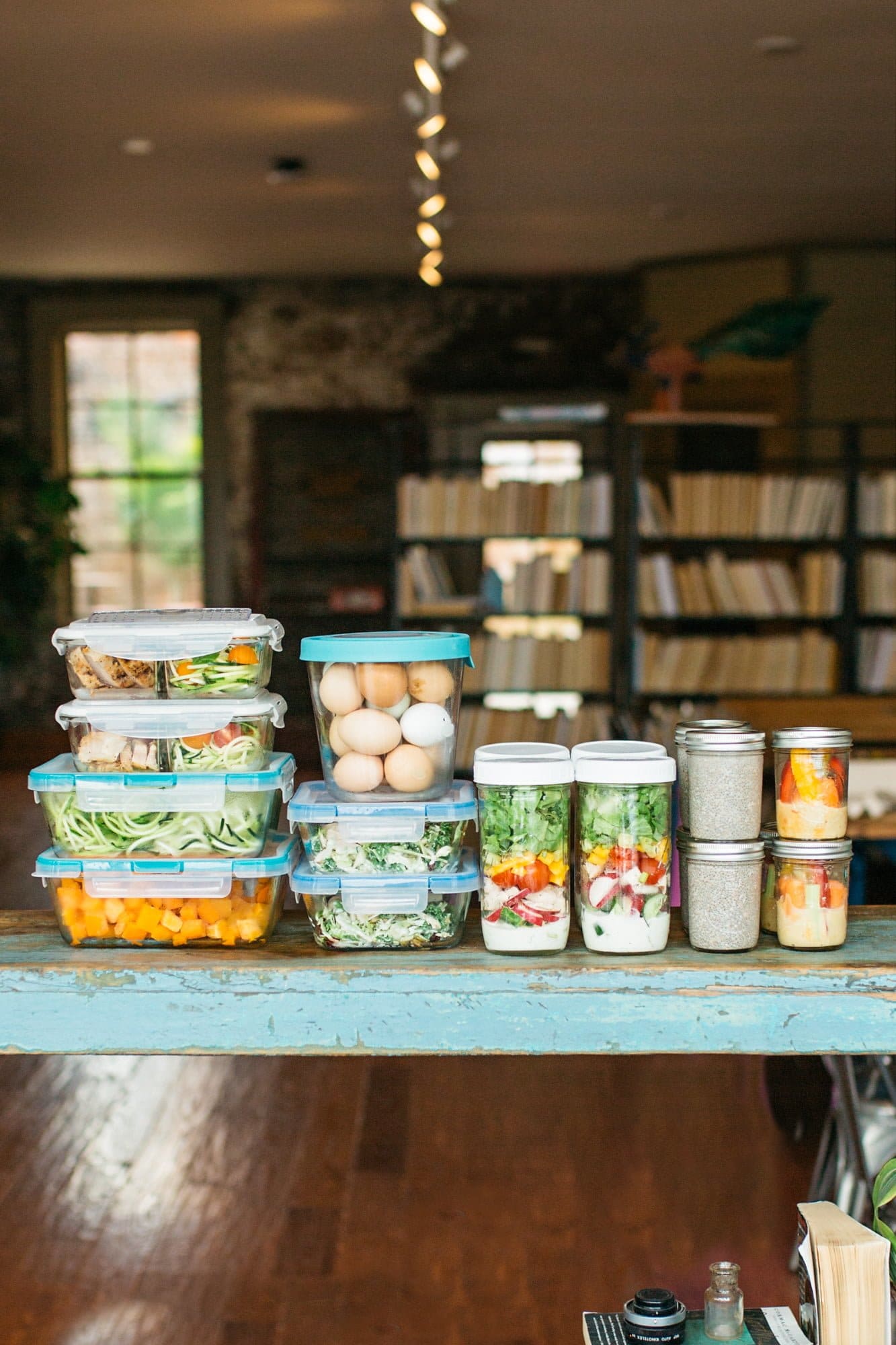 Glass containers filled with a week's worth of meal prep.