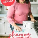 Woman using a DIY Disinfecting Wipe to clean a counter. A text overlay reads "All Natural and Reusable Cleaning Wipes."