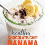 A glass jar filled with chocolate chip banana overnight oats sits on a marble countertop. The oats are garnished with banana slices and chocolate chips, and a spoon dips into the jar. A text overlay reads "Healthy Chocolate Chip Banana Overnight Oats."