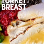 Sliced turkey on a plate and drizzled with gravy. A text overlay reads "Instant Pot Turkey Breast."