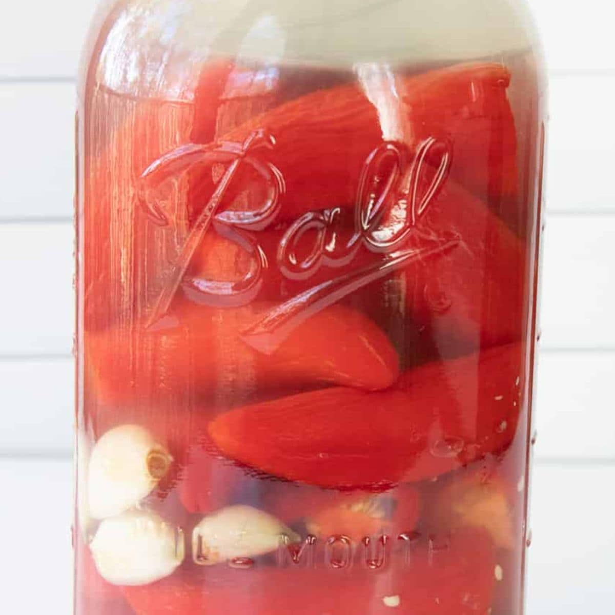 Fermented peppers and garlic for hot sauce turn cloudy