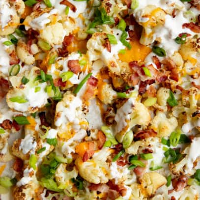 Roasted cauliflower topped with bacon, cheese, green onions, and ranch.