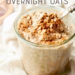 A spoon scoops into a glass jar of chai overnight oats. A text overlay reads "Chai Latte Overnight Oats."