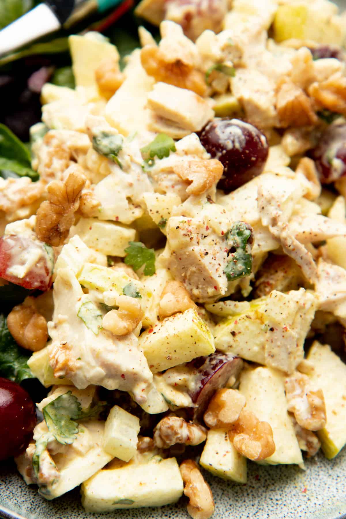 Curry chicken salad includes apples, walnuts, and grapes.