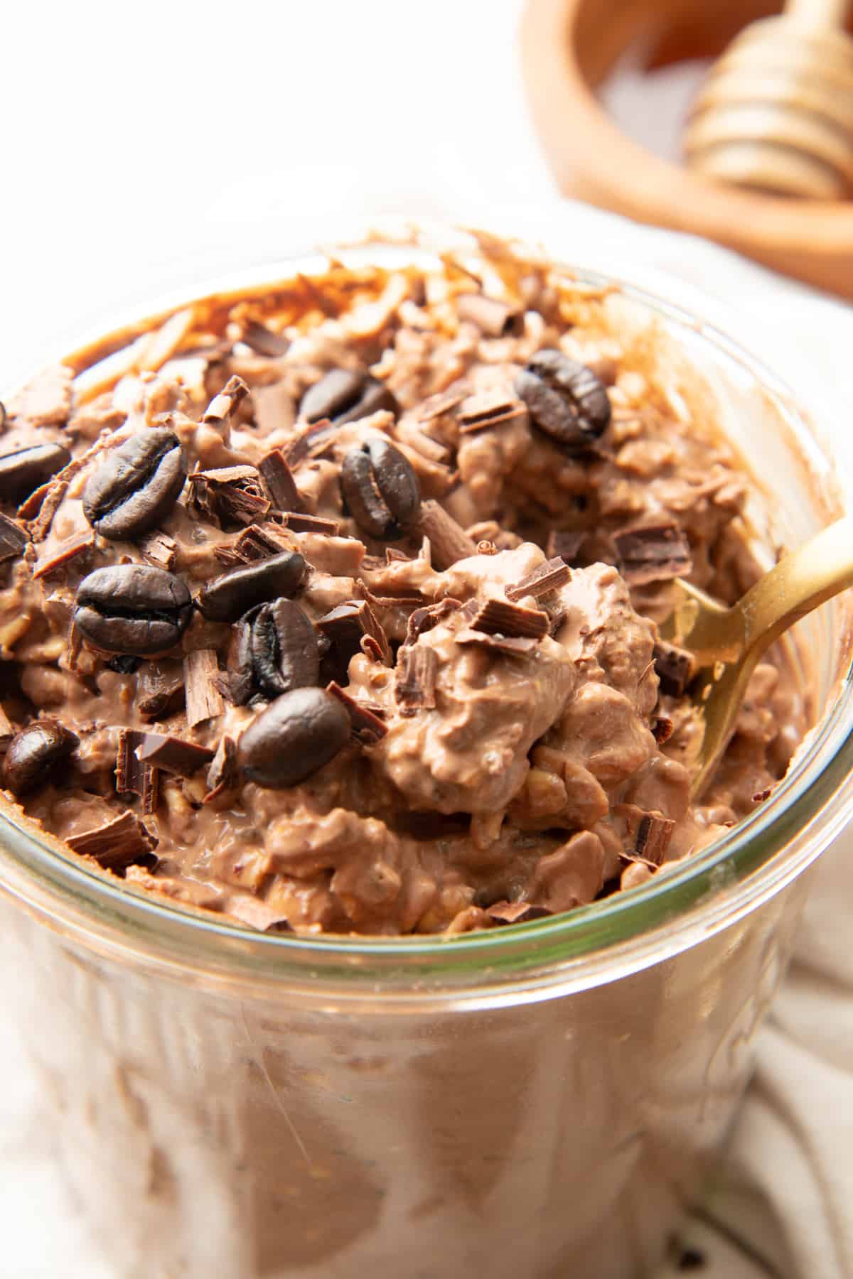 Close up of mocha overnight oats garnished with espresso beans.