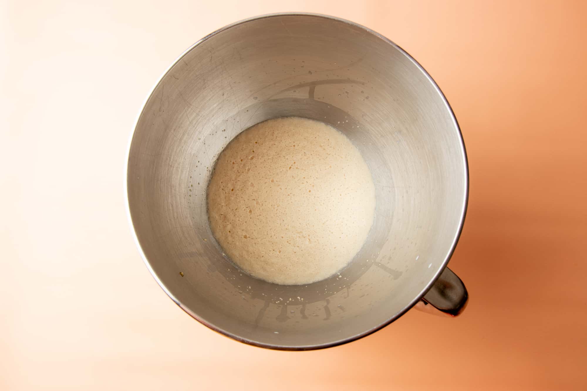 A bowl holds proofed yeast.