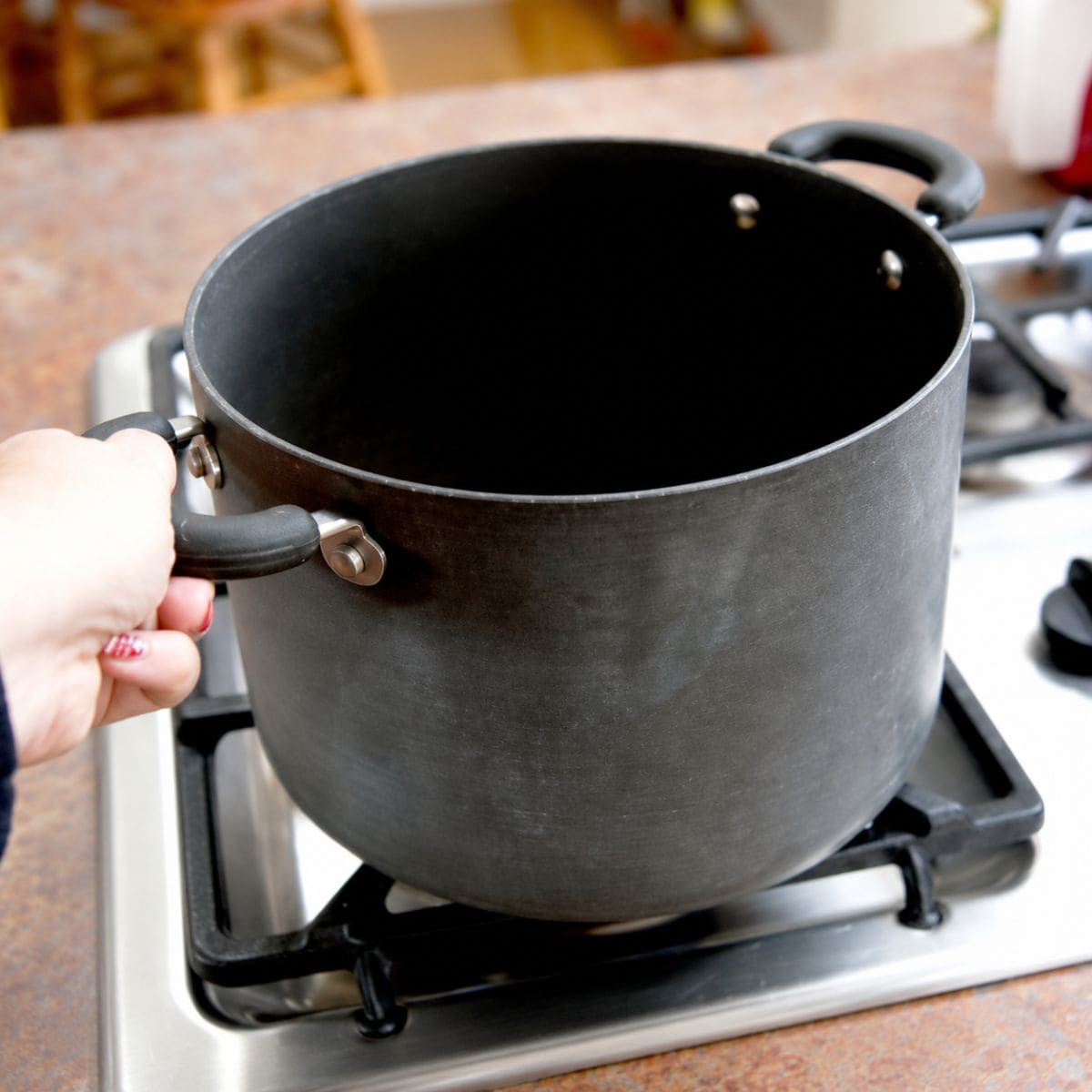 Shaking popcorn pot on stove