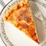 Close-up of a plated slice of hoosier sugar cream pie showing the topping.