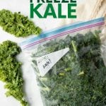 Frozen kale in a closed, Ziploc freezer bag with fresh kale beside it. A text overlay reads, "How to Freeze Kale."