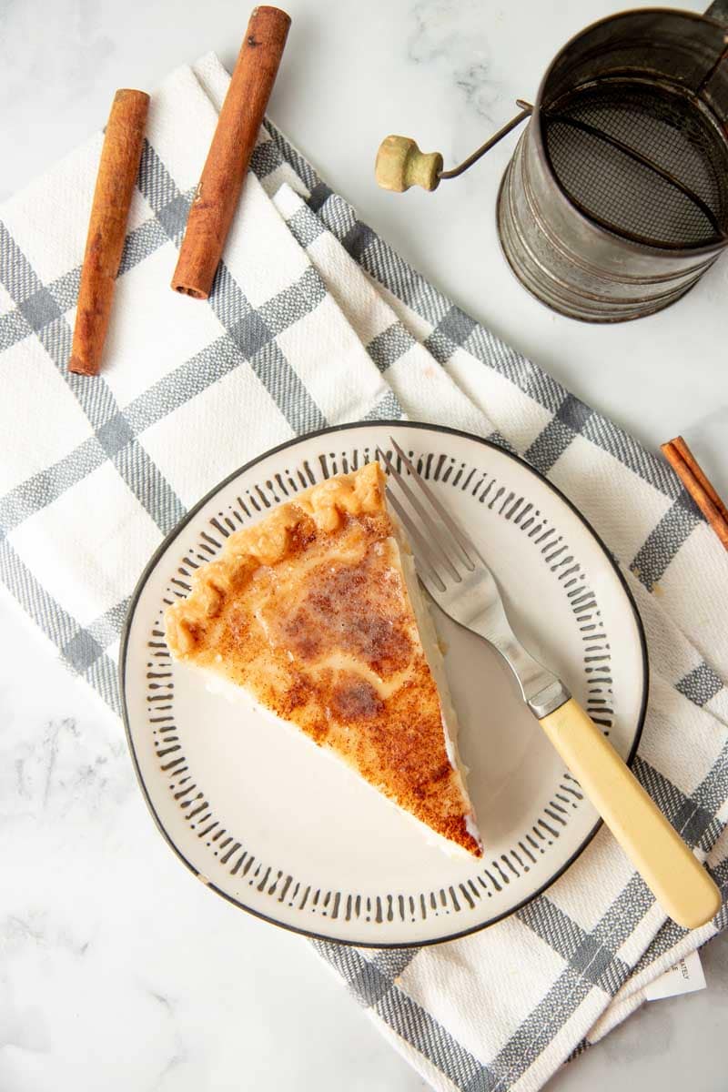 Overhead of a plated slice of pie with a fork.