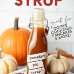 A flip-top glass bottle filled with pumpkin spice syrup sits among decorative pumpkins, cinnamon sticks, and whole star anise. A text overlay reads, "Pumpkin Pie Syrup. Great for Coffee, Cocktails, Pancakes, & More!"