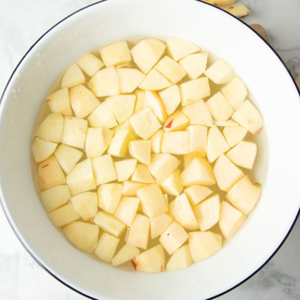 Apple chunks in bowl treated to prevent browning