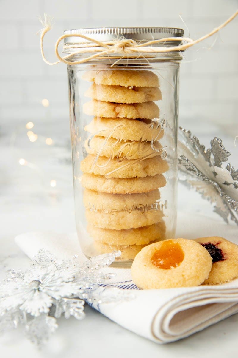 Finished shortbread cookies stacked up in a Ball Mason Jar for gifting.