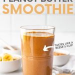 A chocolate peanut butter smoothie sits in front of small bowls filled with the ingredients to make the smoothie. A text overlay reads, "Chocolate Peanut Butter Smoothie. Tastes like a Reese's Cup!"