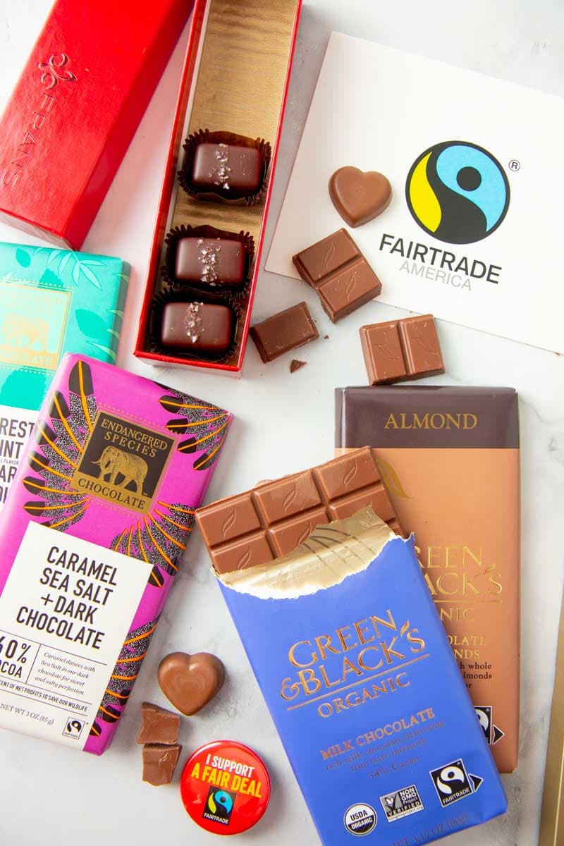 Fairtrade chocolates in various forms sit on a marble countertop.