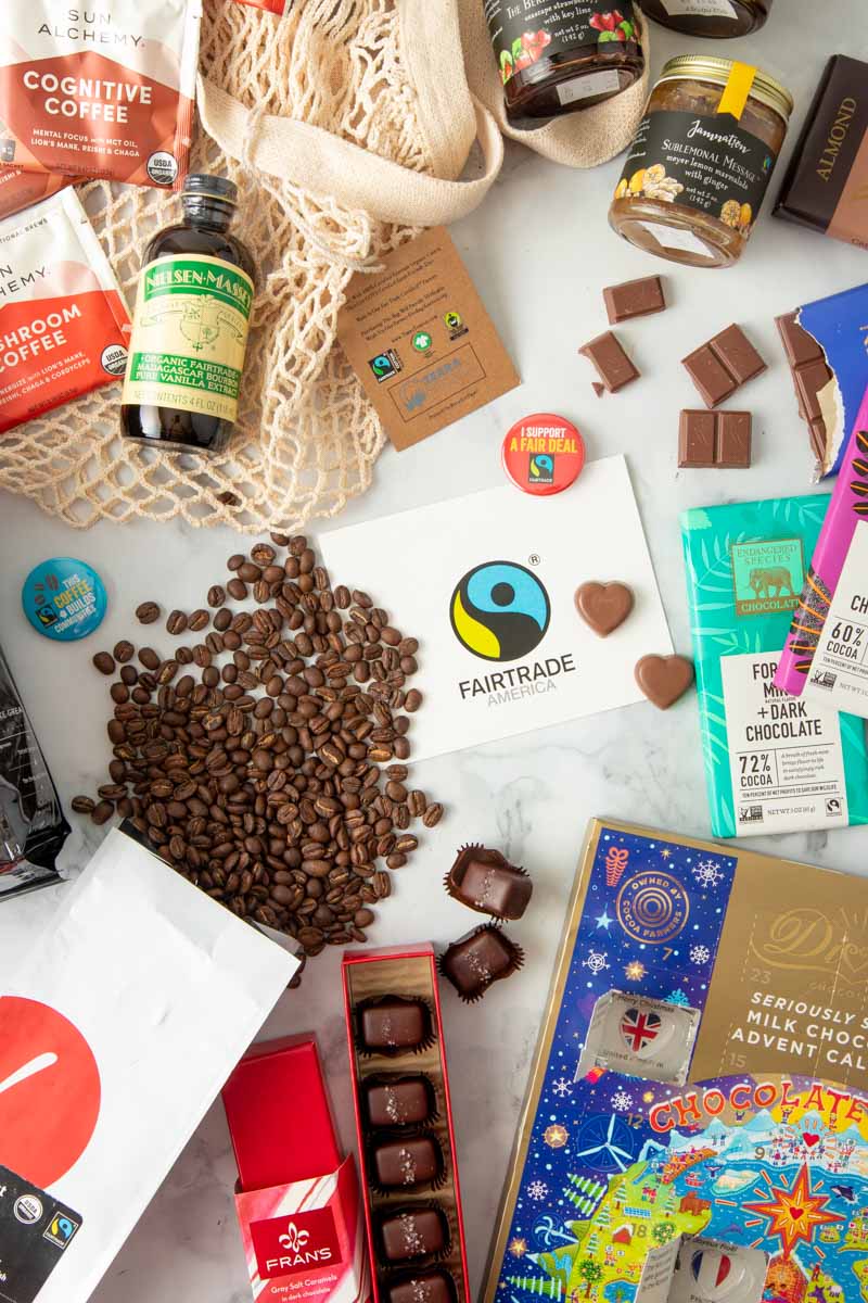An assortment of fairtrade gift ideas are laid out on a table.